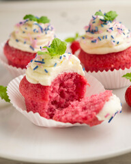 Red velvet muffins with sweet and caramel frosting.