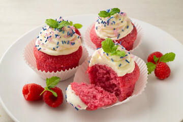 Red velvet muffins with sweet and caramel frosting.