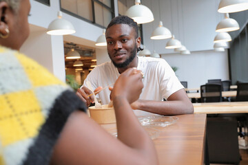 Coworkers enjoying lunch in office