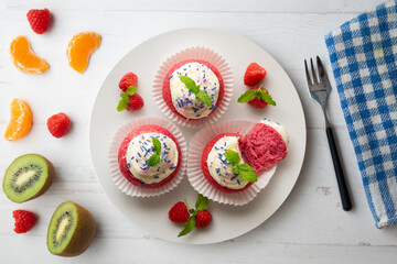 Red velvet muffins with sweet and caramel frosting.