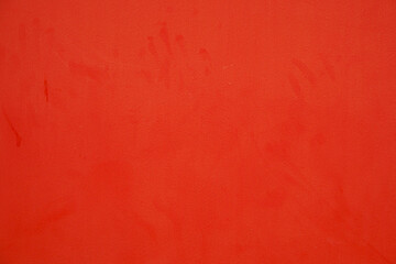 Obraz premium Red wall with human handprints, white during Halloween