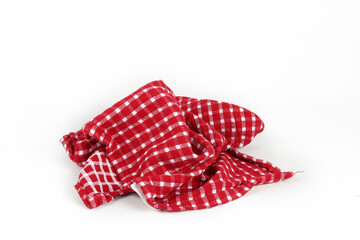 red and white tea towel with isolated gingham pattern on a white background 