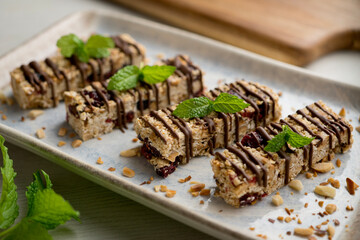 Homemade energy bars made with oats, nuts and chocolate.