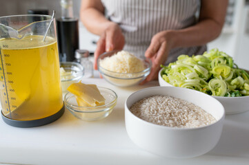 Homemade cooking Fresh ingredients for making a italian leek risotto on kitchen counter