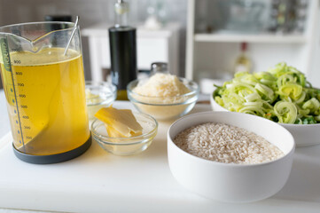 Homemade cooking Fresh ingredients for making a italian leek risotto on kitchen counter