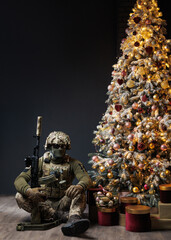Ukrainian soldier near the Christmas tree