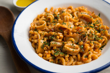 Fideua paella with seafood and squid. Traditional Spanish recipe.