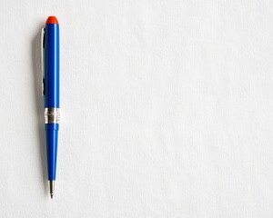 Closeup Blue Pen with Red Top on Textured White Background - Minimalist Office Stationery Concept