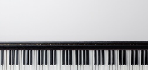 Fototapeta premium Elegance in Monochrome Close-up of Piano Keys on White Surface - Musical Harmony and Serenity
