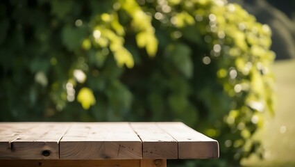A wooden picnic table in a park surrounded by nature with trees and grass during a sunny day