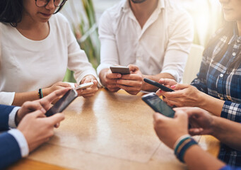 Business people, team and networking with phone for communication, data share or sync. Creative employees, coffee shop and smartphone for meeting, social media or collaboration with software app