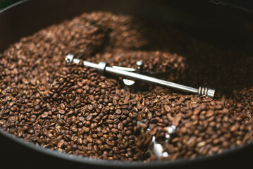 Fresh coffee beans in the coffee roaster.