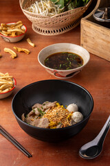 Delicious Thai Noodle Dish with Toppings and Sauces