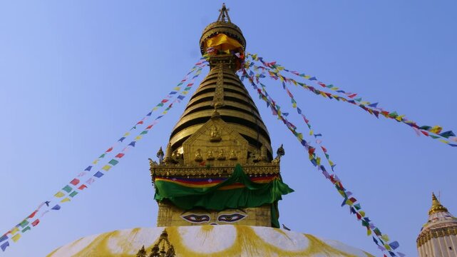 UNESCO world heritage site called Swayambhunath Stupa a Buddhist temple with colorful Tibetan prayer flags in Kathmandu Valley.