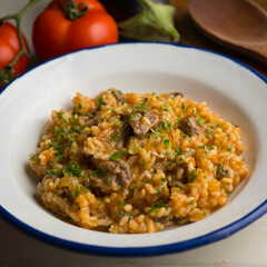 Rice paella with Iberian pork cheek. Traditional spanish tapa with iberic pork.