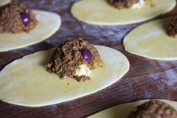 Photograph of meat empanadas preparation.