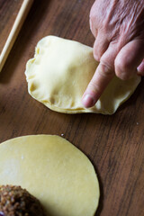 Photograph of meat empanadas preparation.