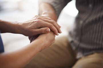 Holding hands, people and support with empathy, prayer and recovery with kindness. Closeup, senior man and woman with sympathy, hope and healing with trust, gratitude and spiritual with counselling