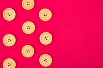 Fototapeta premium Pink fleece fabric with wooden buttons 