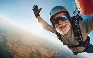 Fototapete happy elder man skydiving © Visualmind