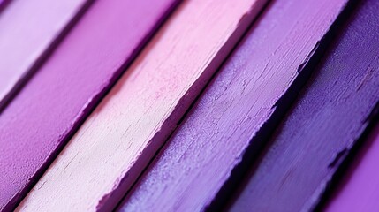 Purple lipstick swatches creating a gradient, ranging from light lavender to deep violet, showcasing the different shades available