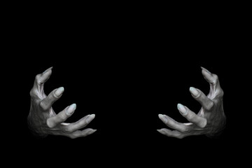 Bony pale male hands of vampire or dead with long fingers and sharp nails, isolated on black. Monster try to hold something, low key, selected focus.