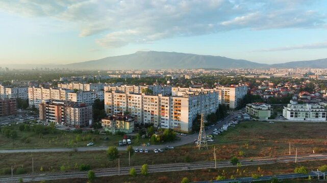 Flying from right to left on the outskirts of Sofia, overviewing Obelya district with beautiful Vitosha Mountains in the background.