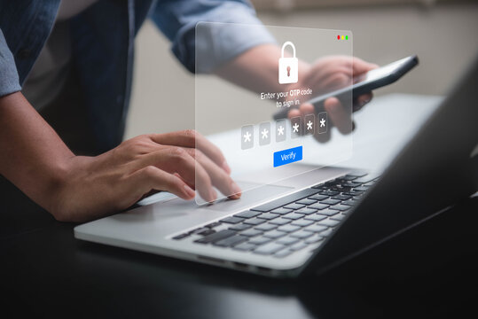 person entering OTP code on laptop for secure two factor authentication login. ensuring secure online authentication. data protection and secured internet access.