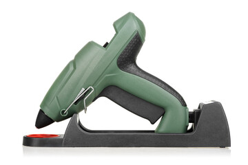 Cordless glue gun with docking station isolated on white.