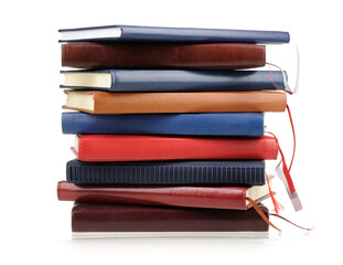 Stack of diaries or books with colorful covers on white background