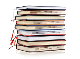 Stack of diaries or books with colorful covers on white background