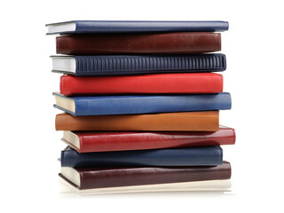 Stack of diaries or books with colorful covers on white background