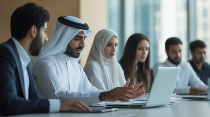 Arab businessman leading a meeting in a diverse office