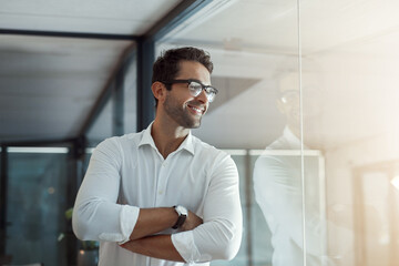 Smile, thinking and business man with arms crossed in office on glass wall for insight, mindset or inspiration. Confident worker, idea and planning future, vision or reflection for view or job growth