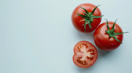 A top view of ripe tomatoes on a white table highlights their vibrant red color and fresh, organic appeal, making them perfect for vegetarian dishes and healthy recipe ideas.