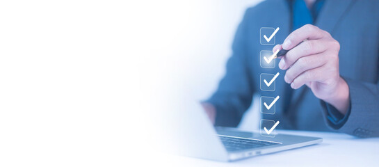 Businessman checklist concept as clipboard document checklist form on the virtual screen Use your...