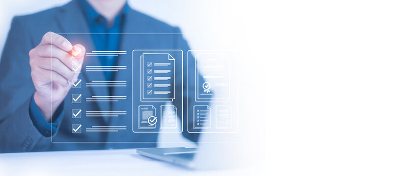 Businessman checklist concept as clipboard document checklist form on the virtual screen Use your hands or a pen to check the correct control gaps and check the quality standards of the work.