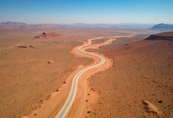 Aerial View of a Winding Road in a Desert