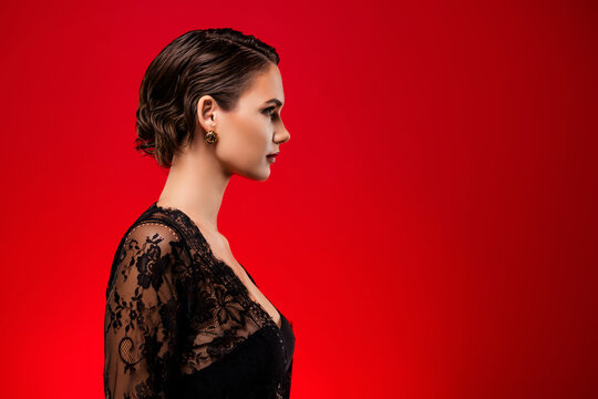 Profile photo of elegant lovely lady advertising news looking empty space isolated on red color background