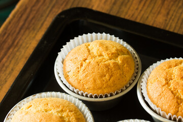Group photo of muffins fresh from the oven.