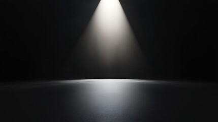 Minimalistic black stage with a bright spotlight highlighting the centre, creating a sense of focus and anticipation
