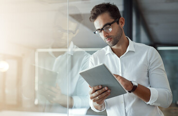 Tablet, thinking and businessman in office online for social media, report and planning in...