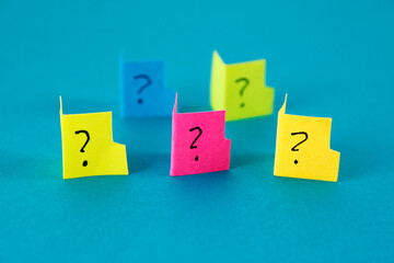Group of colorful folders with question marks