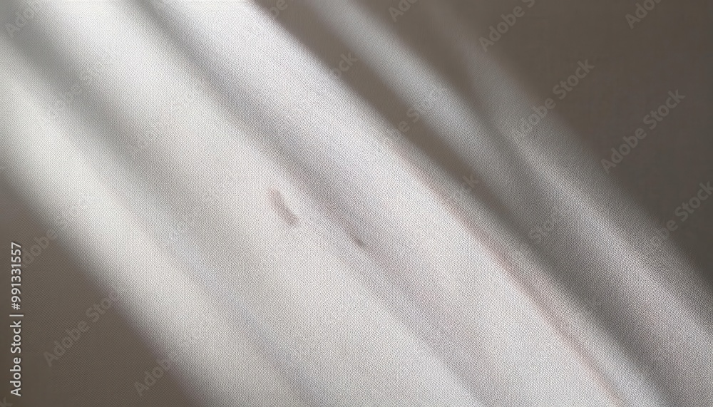 Poster Soft Sunlight Casting Gentle Shadows on Textured White Wall. Minimalist Natural Lighting Effect Creating Calm and Serene Atmosphere with Smooth Transition from Light to Shade. Background For Product 