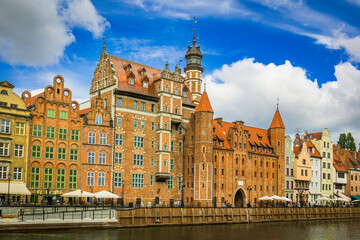Beautiful city of Gdansk in the margins of the Motlawa river with the touristic boats and coloured buildings