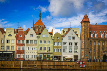 Beautiful city of Gdansk in the margins of the Motlawa river with the touristic boats and coloured buildings