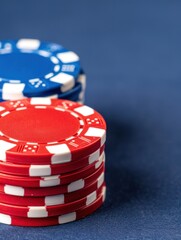 Close-Up of Red and Blue Poker Chips Stacked on a Blue Table.