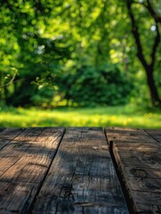 A picnic table in a sunny forest clearing with green grass and trees.