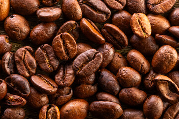 Close-up of properly roasted coffee beans. Roasted Arabica coffee beans.