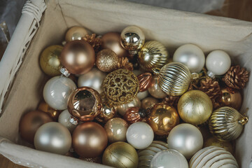 Christmas festive decor, lanterns, basket with Christmas balls. Christmas tree. Winter holidays.